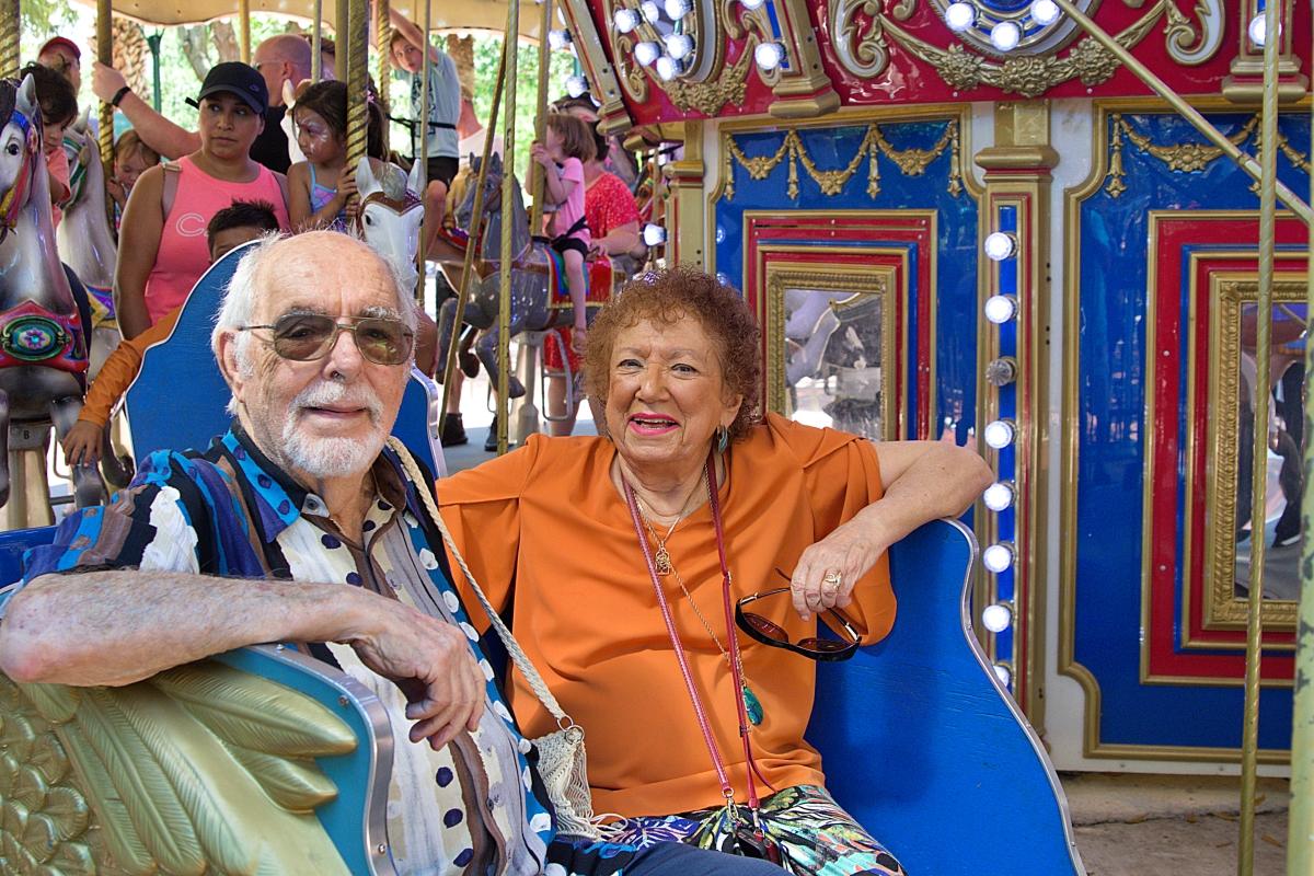 Elaine Kleinman and husband on carousel