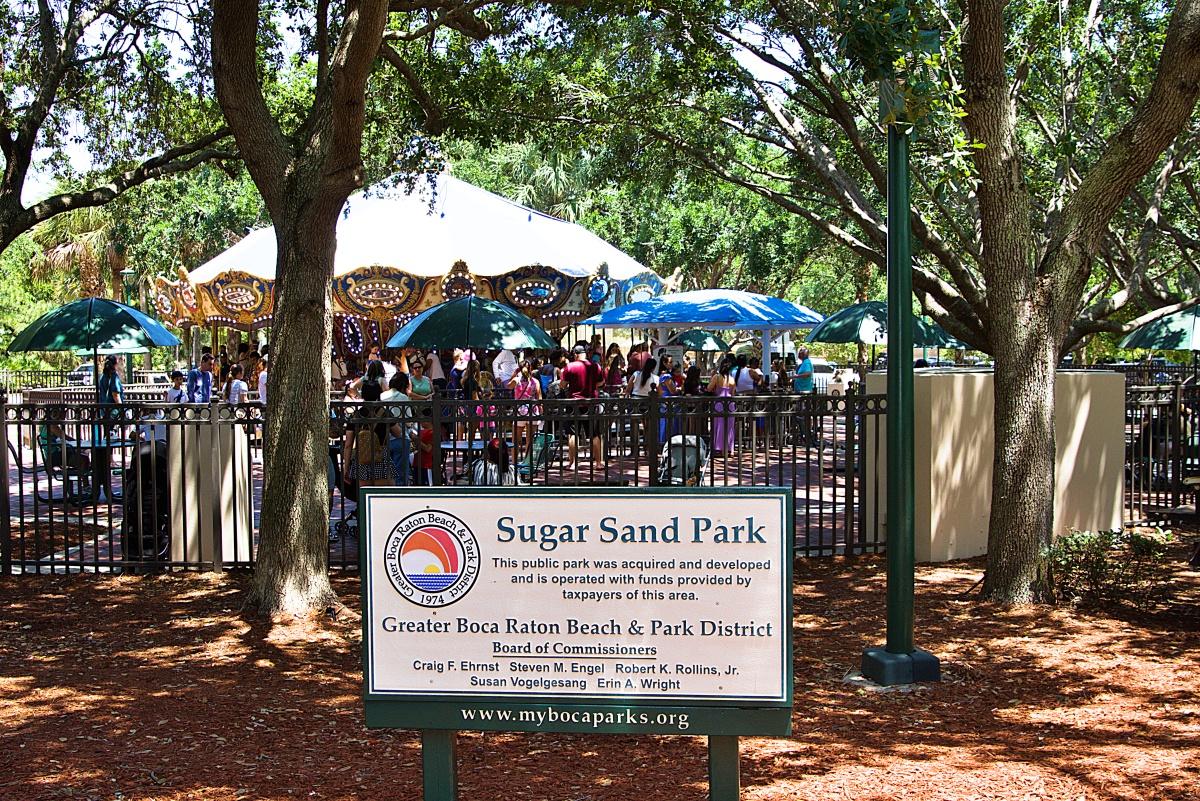 Sugar Sand sign with the carousel in the background