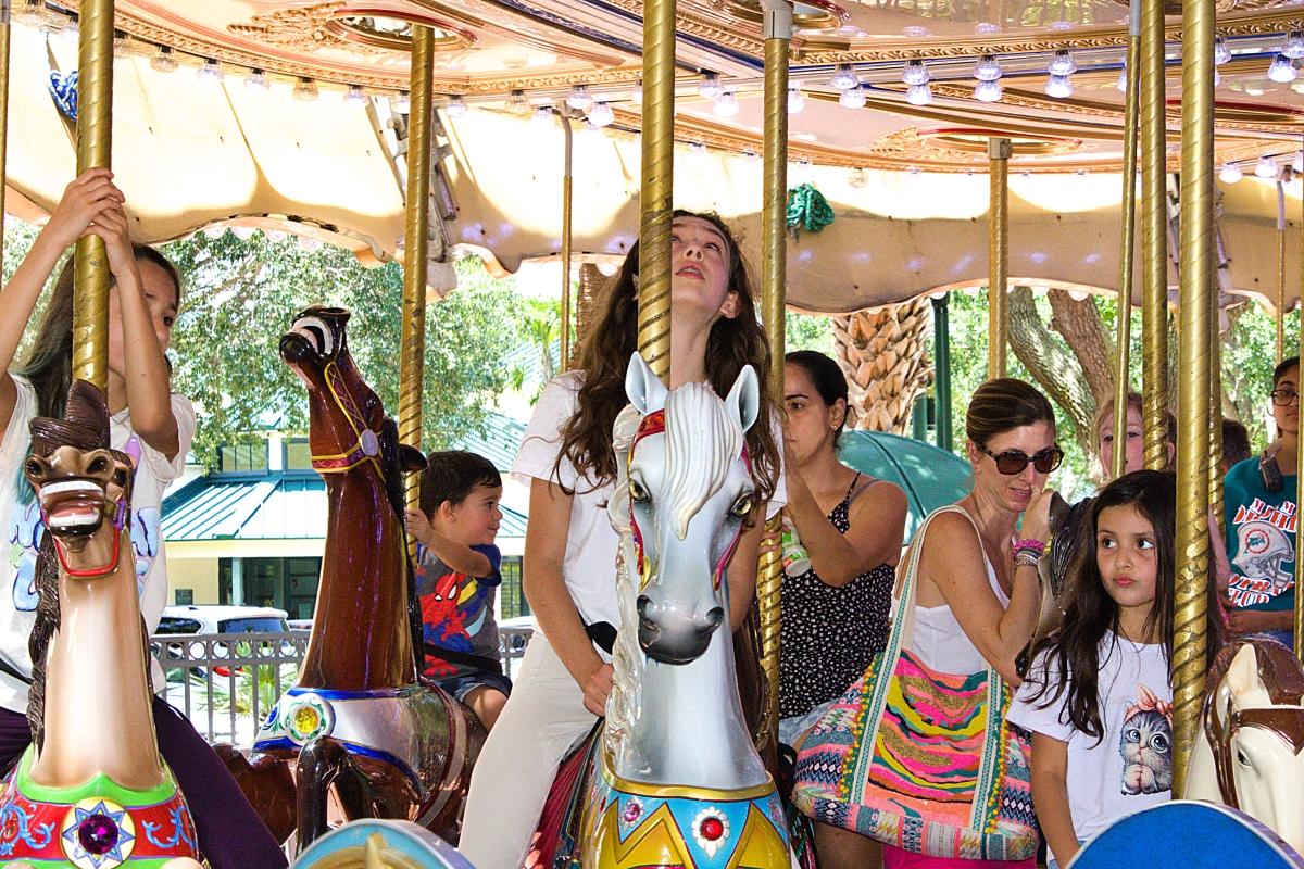 Three girls on the carousel