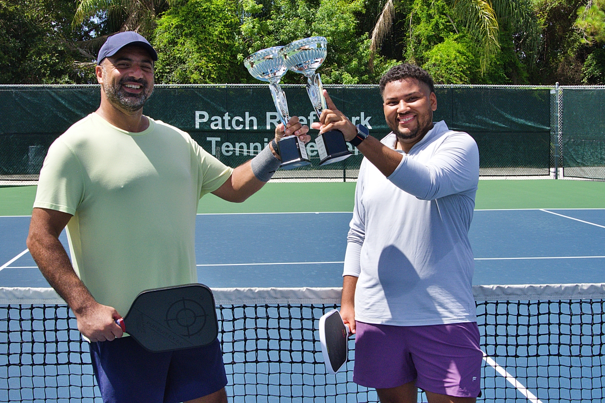 Dan Louk and Christopher Kopko toast their Liberty Cup Pickleball championships