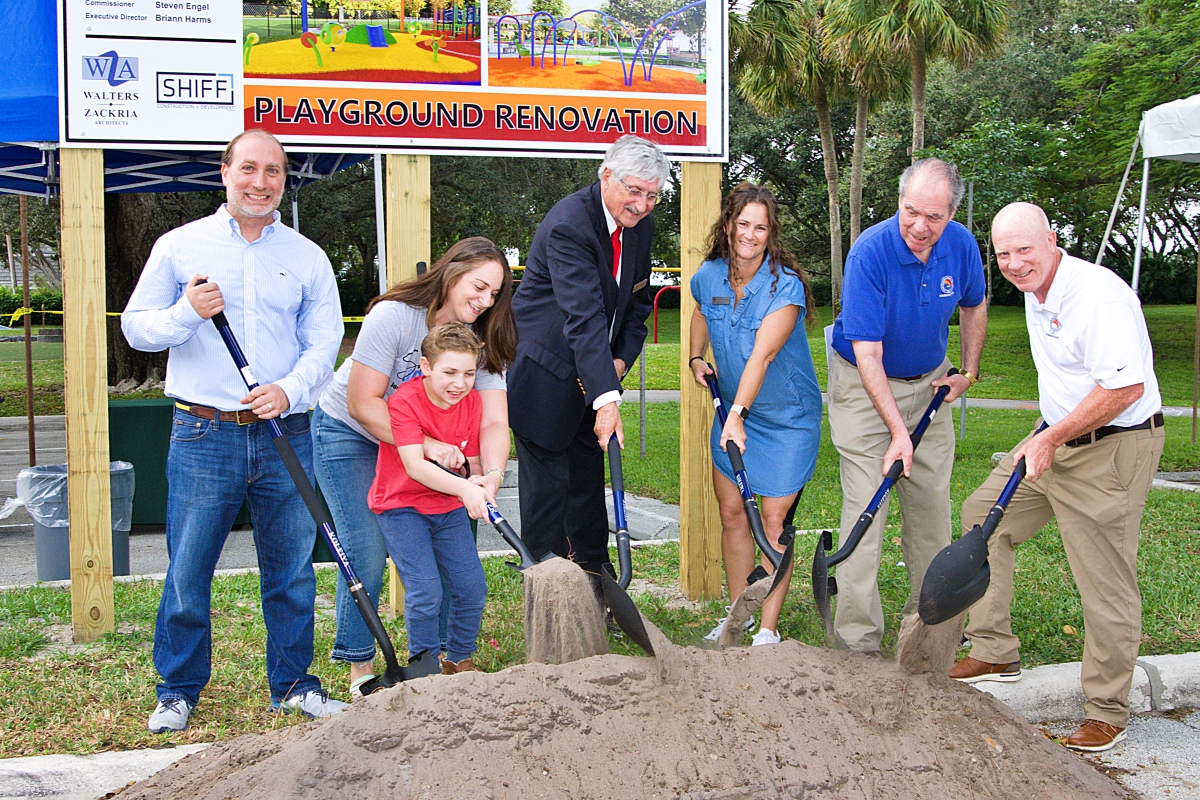 District Commissioners and the Ogmans put their shovels in the sand.