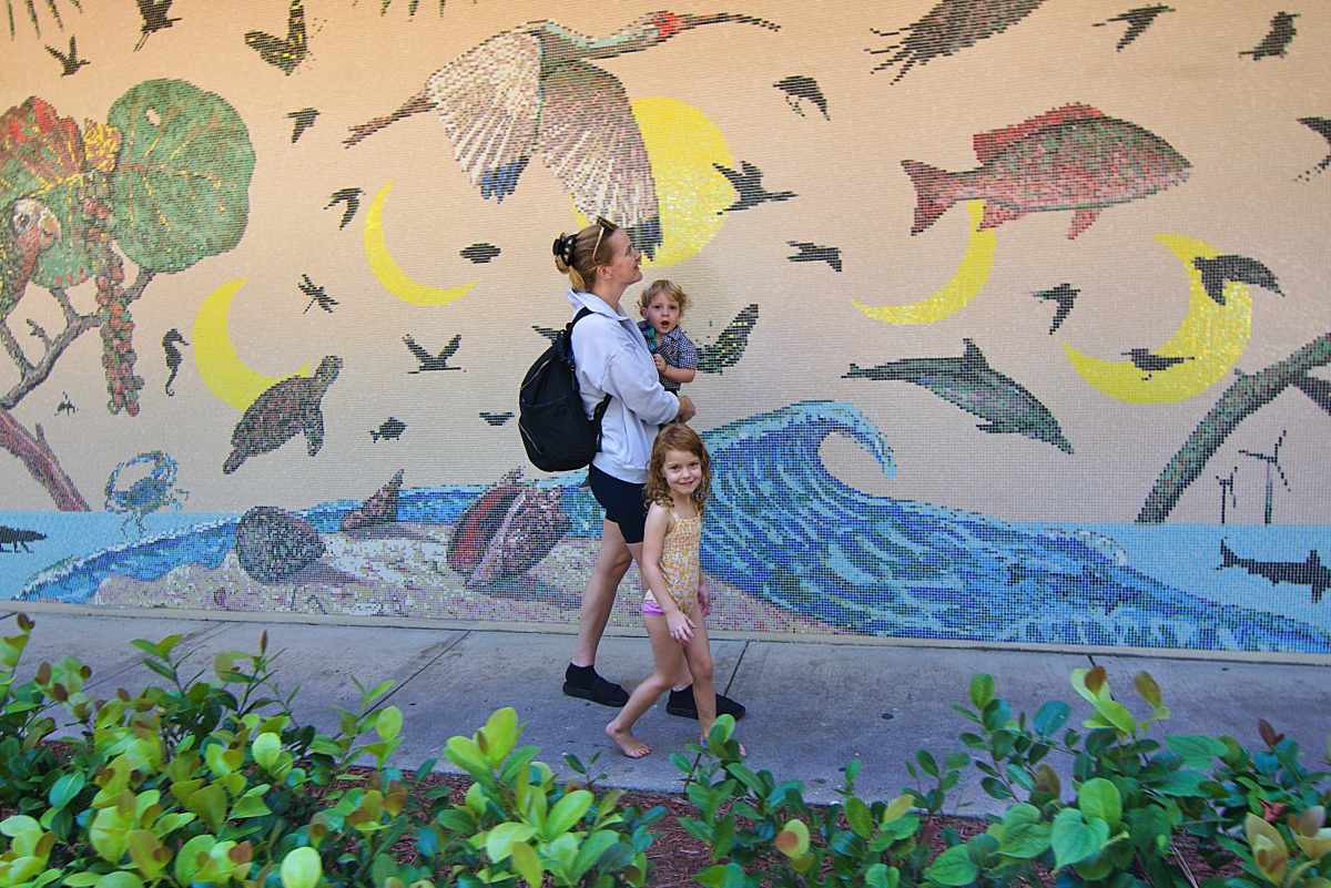 Visitors view mural