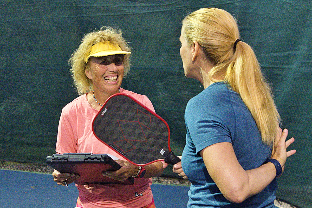 Patch Reef pickleball coach Jane Wadsworth (left) smiles at one of the participants of her ratings clinics