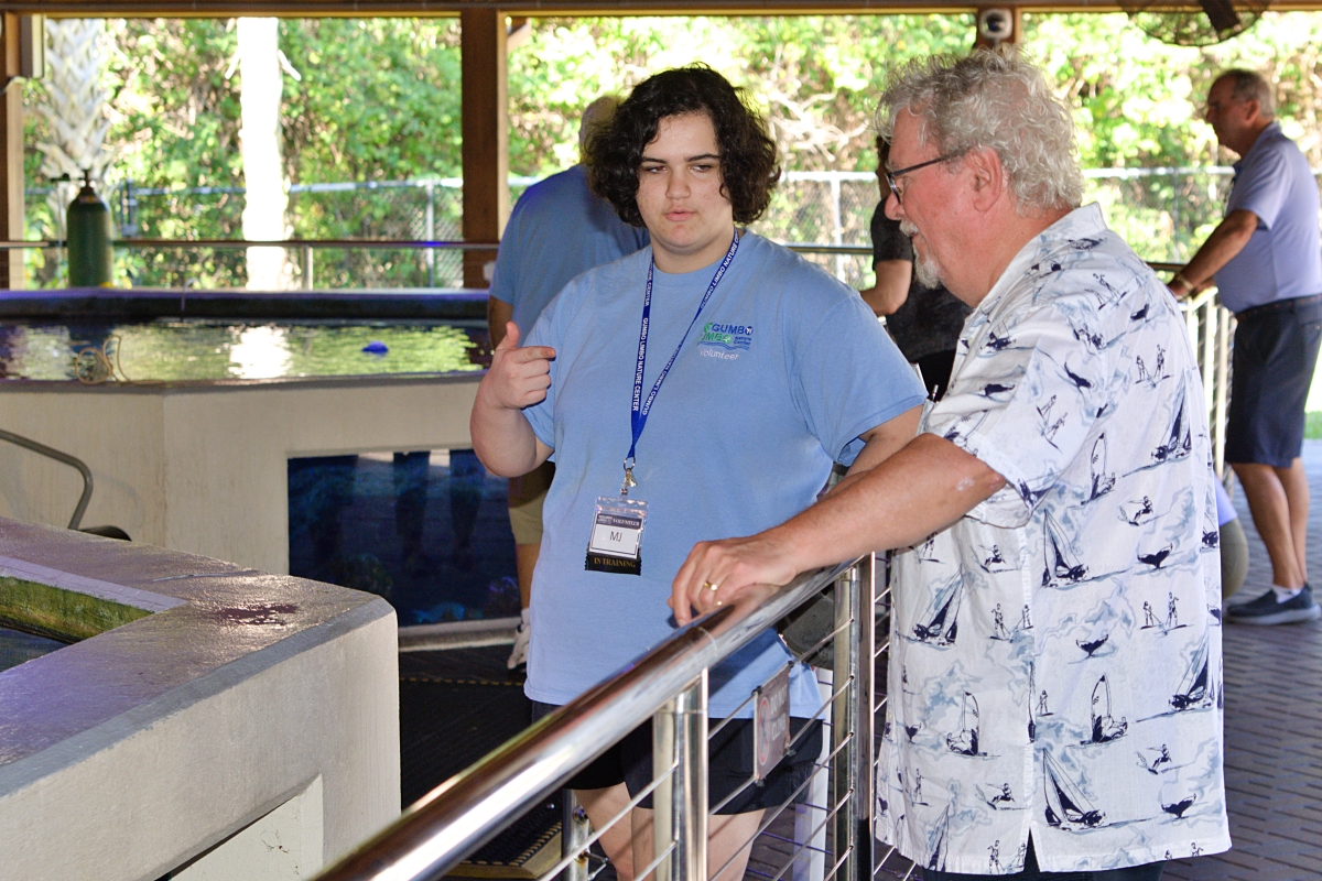 Mikaela Hill talks with a visitor at the Gumbo Limbo Nature Center