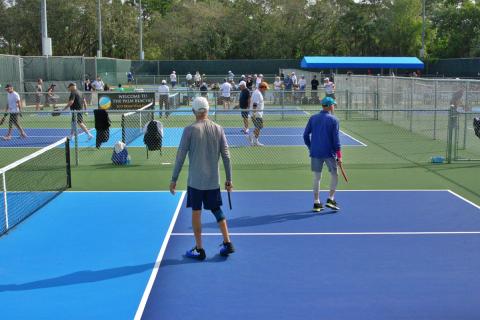 Crowded pickleball courts for the Boca Raton Masters tournament.